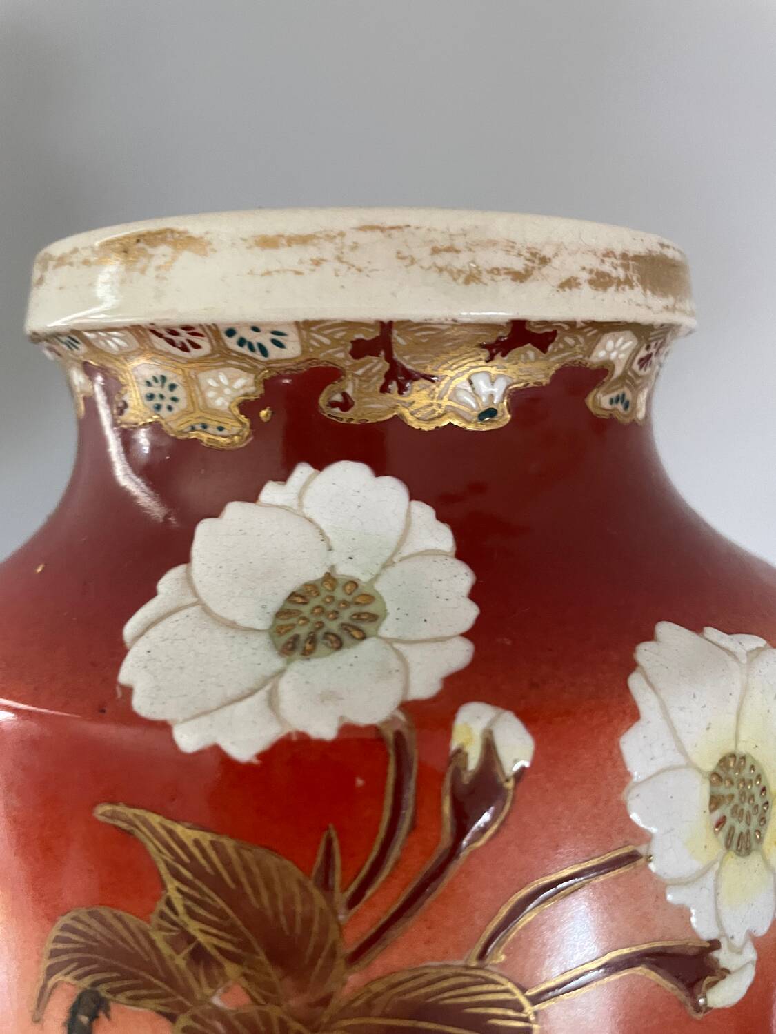 Pair of antique vases with butterfly and flower motif.