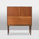 Rosewood chest of drawers with 2 drawers, forming a secretary. 1970s.