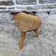 Farm stool in raw wooden sitting in the shape of a popular art