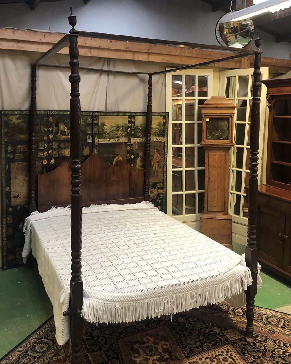 Four-poster bed in late 19th century mahogany