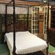 Four-poster bed in late 19th century mahogany