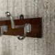 Wall coat rack from the 1950s-60s in solid oak and stainless steel.