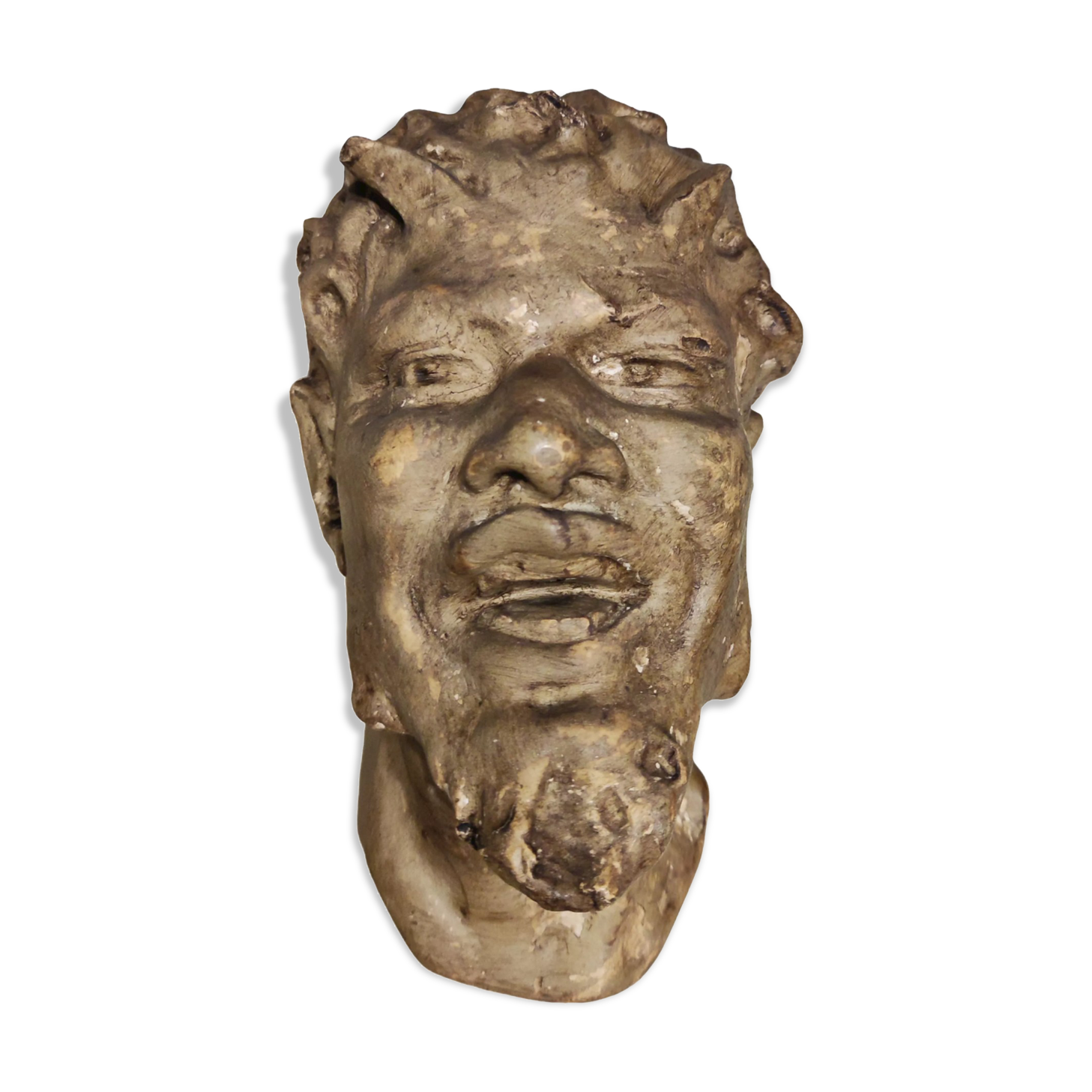 Head of satire in plaster