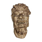 Head of satire in plaster