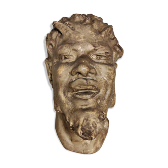 Head of satire in plaster