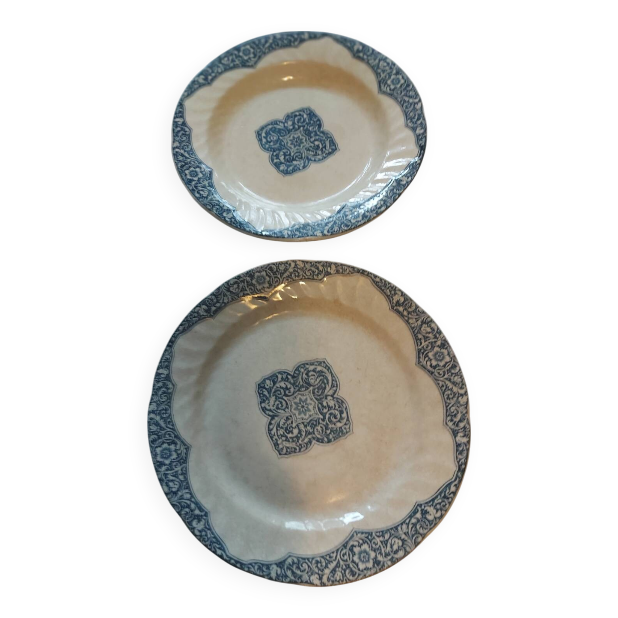 Two antique 19th-century plates, one flat and one deep, from Gien.
