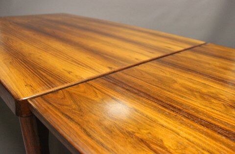 Teak dining table designed by Henning Kjaernulf and manufactured 60 years