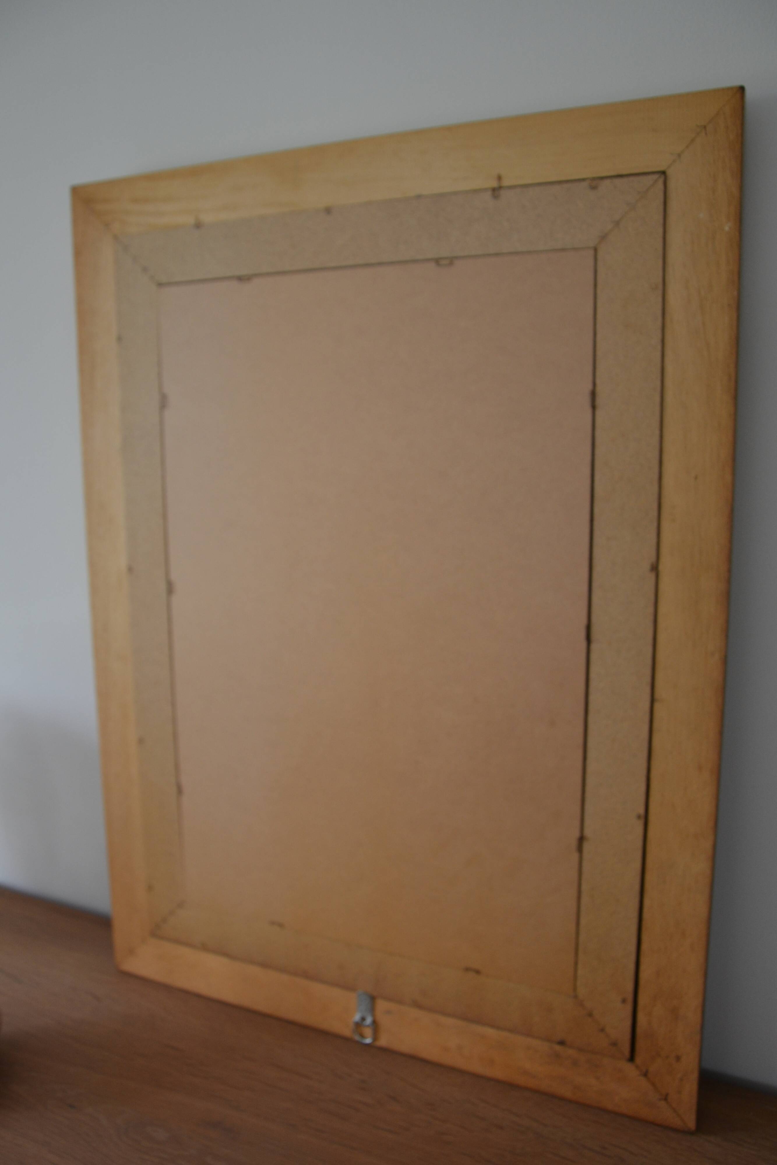 Large mirror with wooden gilded and carved frame.