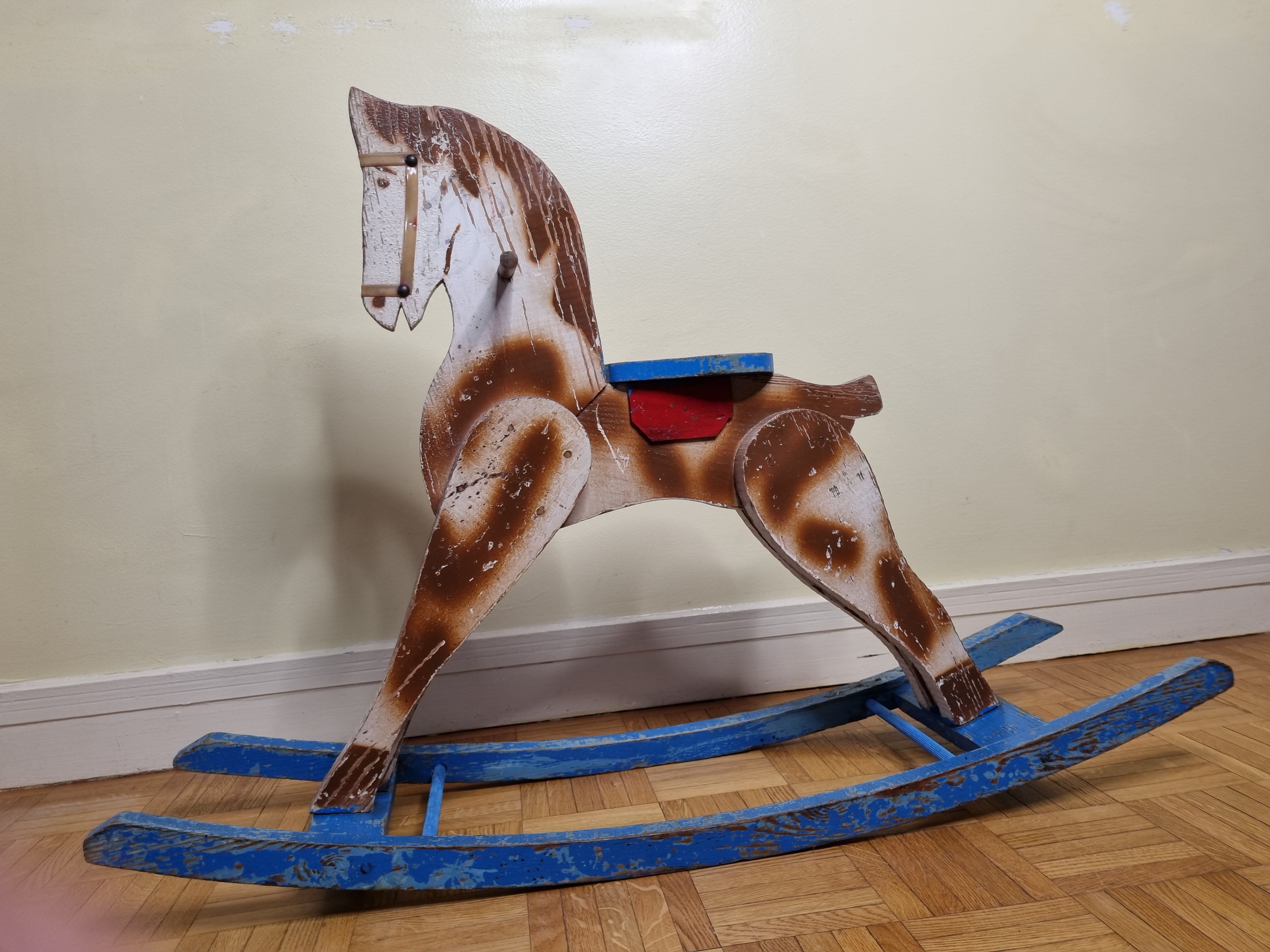 Old rocking horse in painted wood, 50s