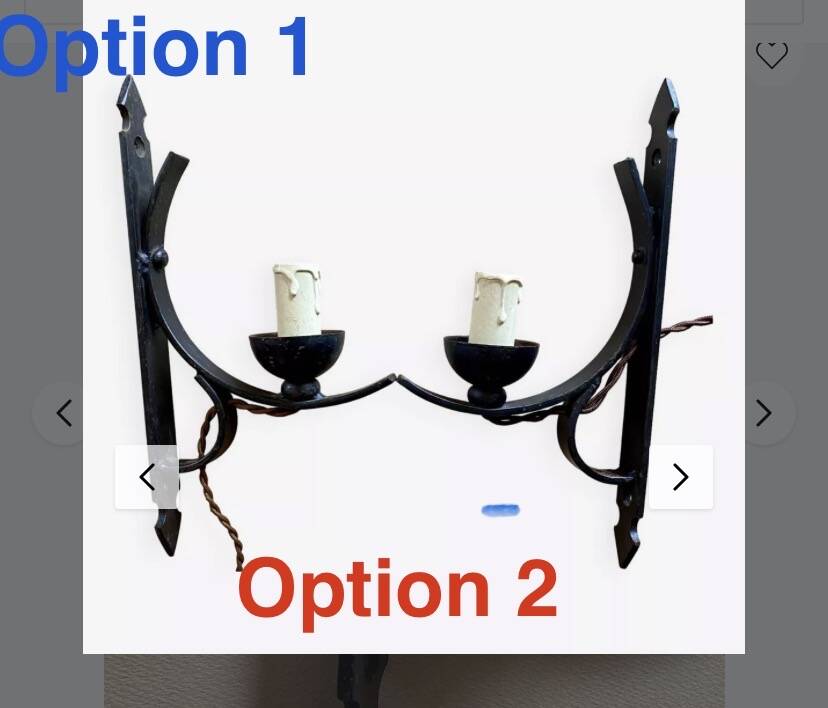 Two wrought iron wall lights, fabric cable.