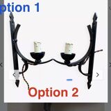Two wrought iron wall lights, fabric cable.