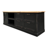 Old workshop furniture transformed into a TV unit.