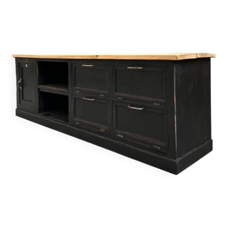 Old workshop furniture transformed into a TV unit.