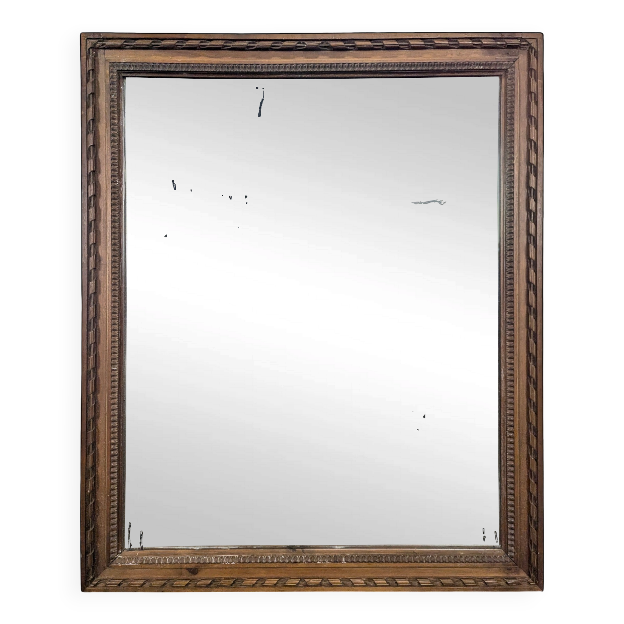 Miroir Napoléon III à cadre en bois sculpté et doré
