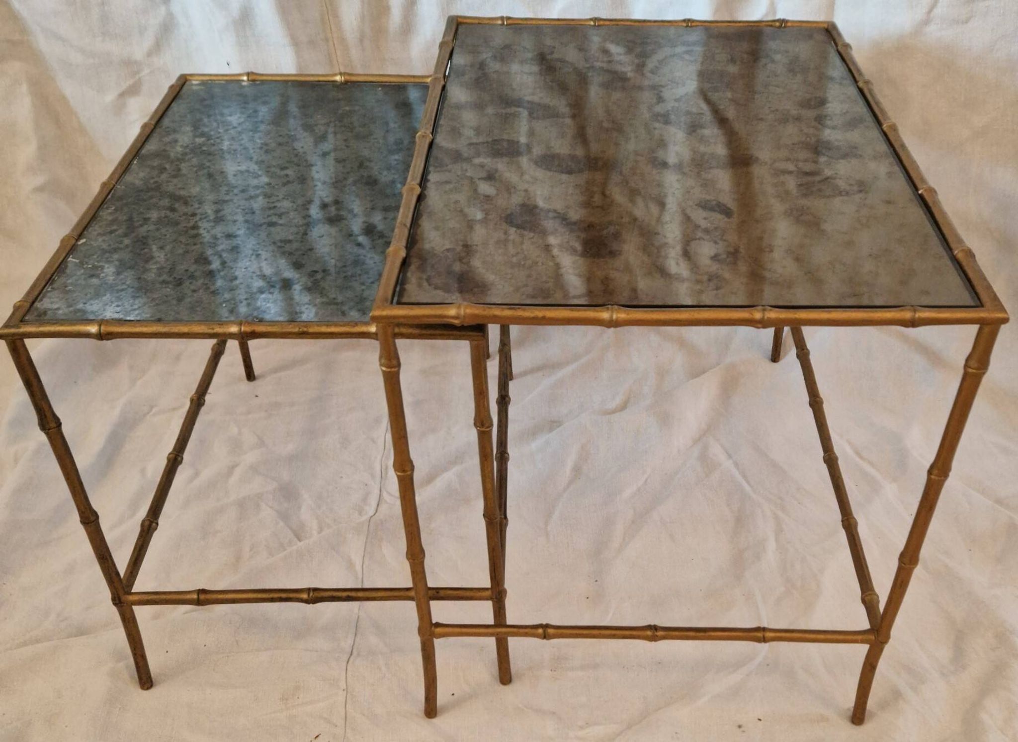 Pair of vintage nesting tables in faux bamboo with a gold finish – distressed mirrors