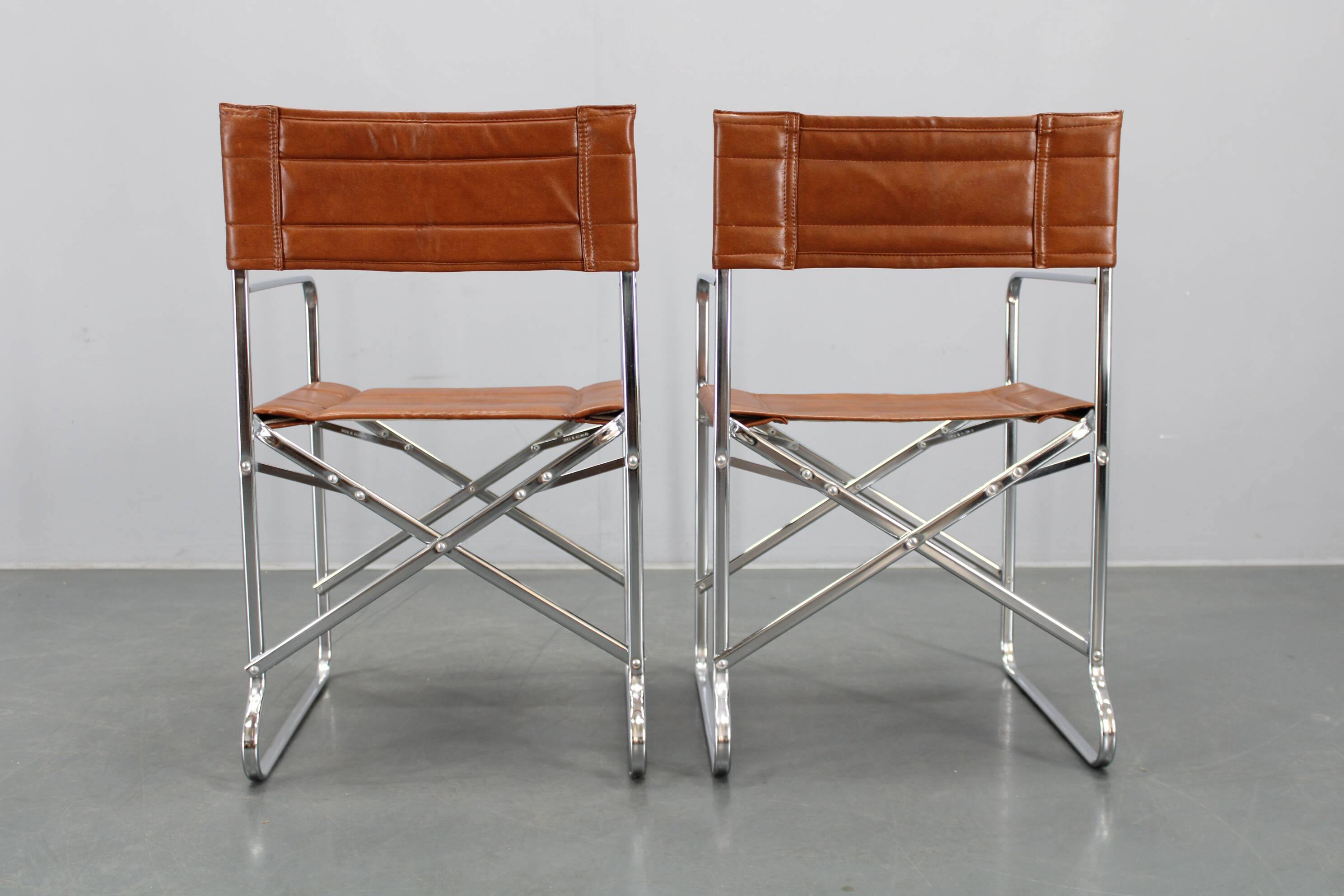 1970s pair of Italian folding chairs with leatherette upholstery