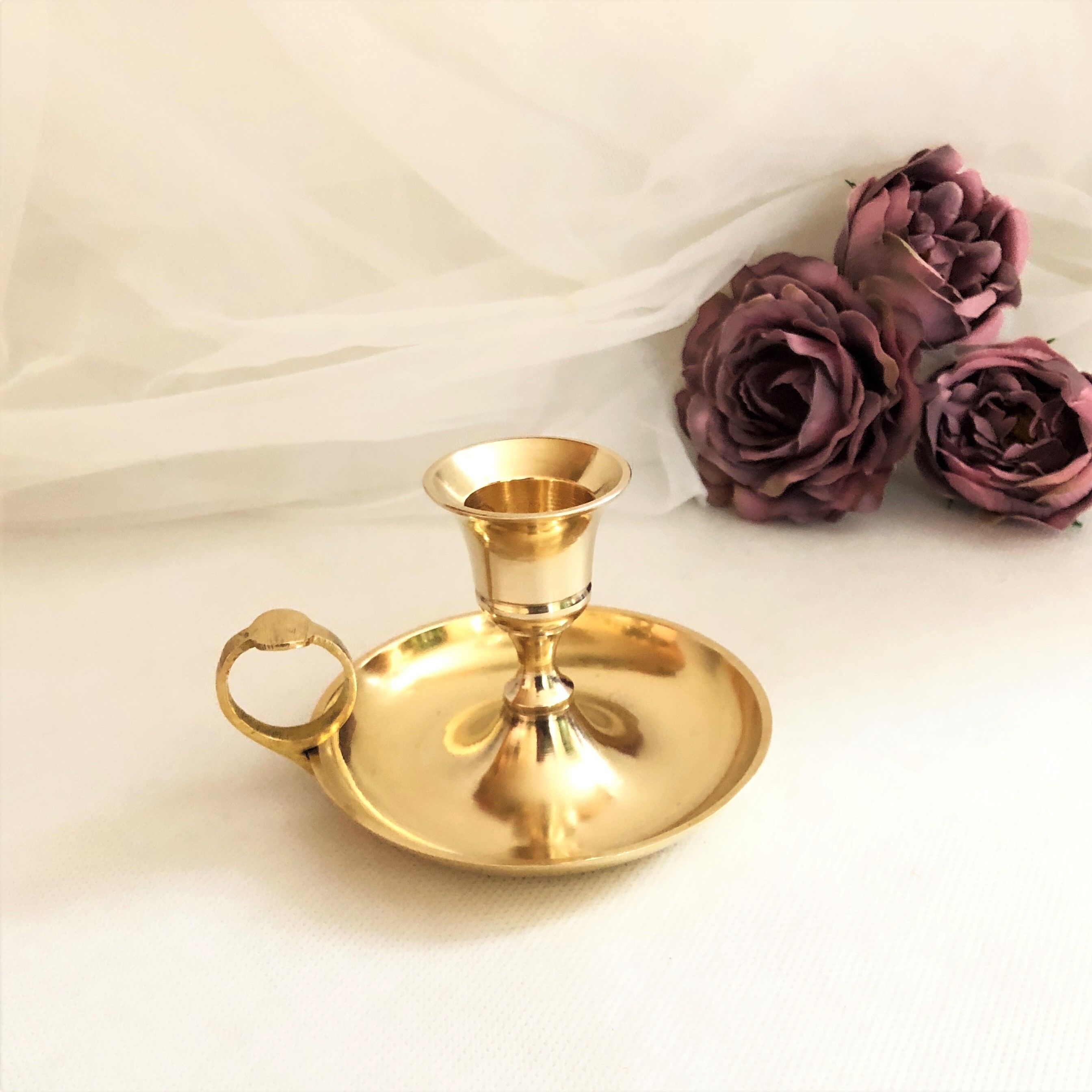 Gilded brass hand candle holder