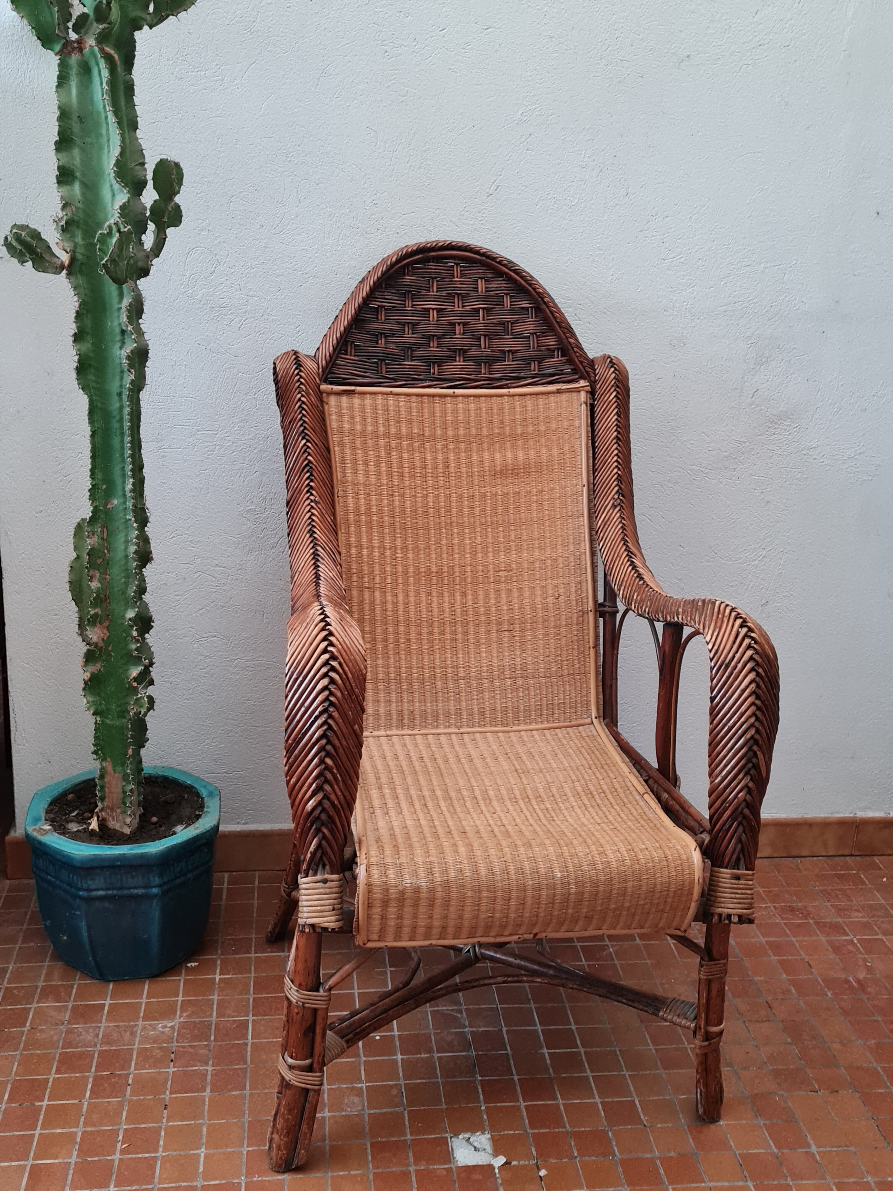 Old rattan armchair circa 1900-1930