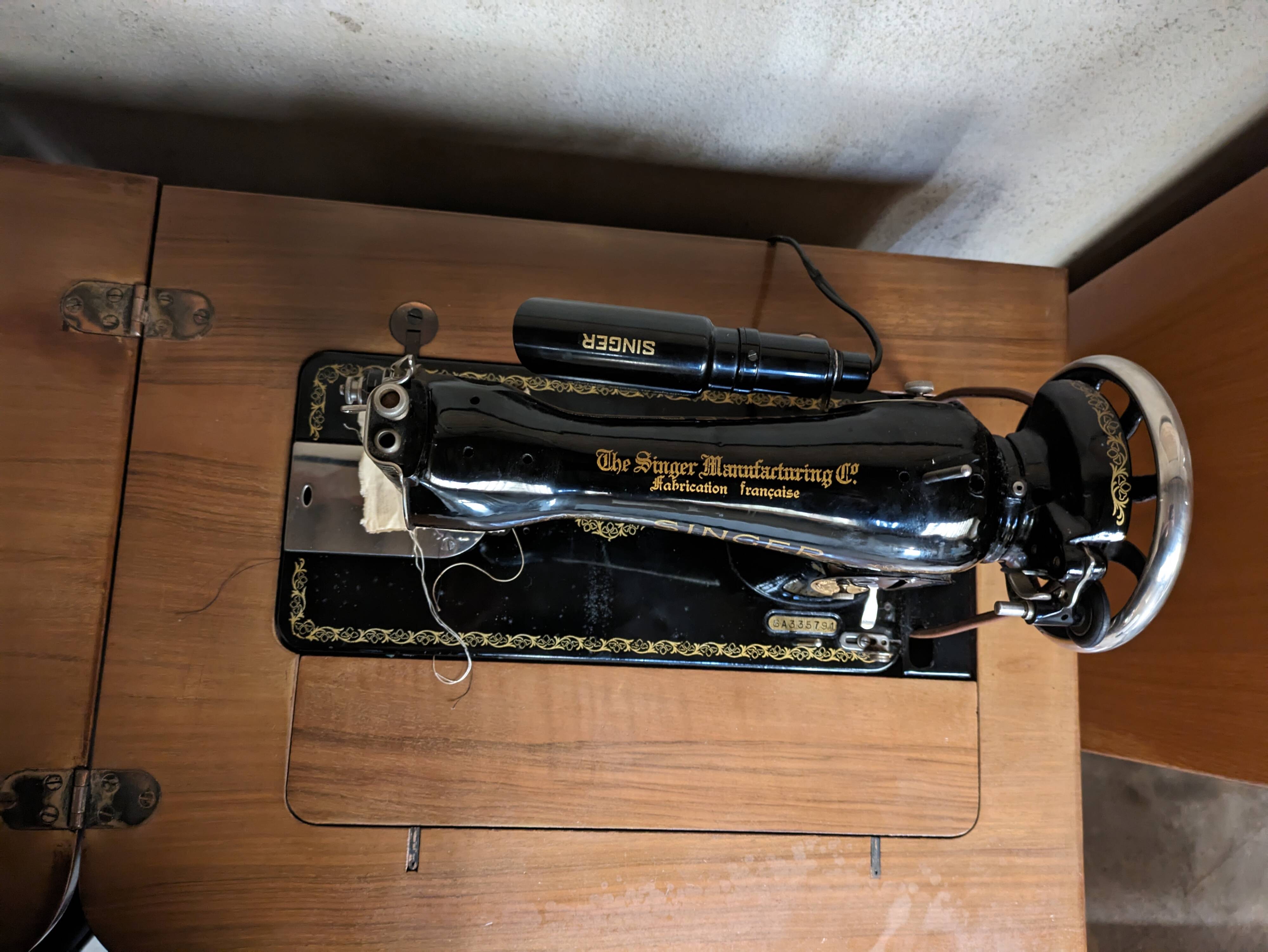 Singer sewing machine in its cabinet