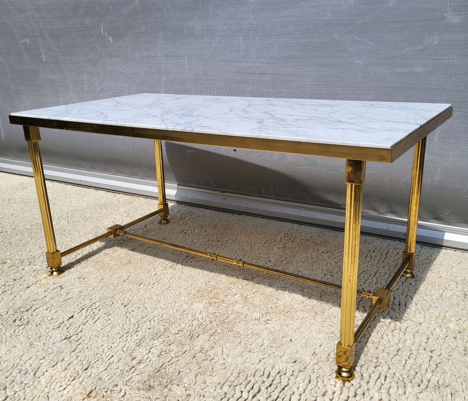 Hollywood Regency style coffee table • marble and brass