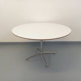 Vintage Eames round table for Vitra in white melamine, wood, and metal.