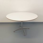 Vintage Eames round table for Vitra in white melamine, wood, and metal.