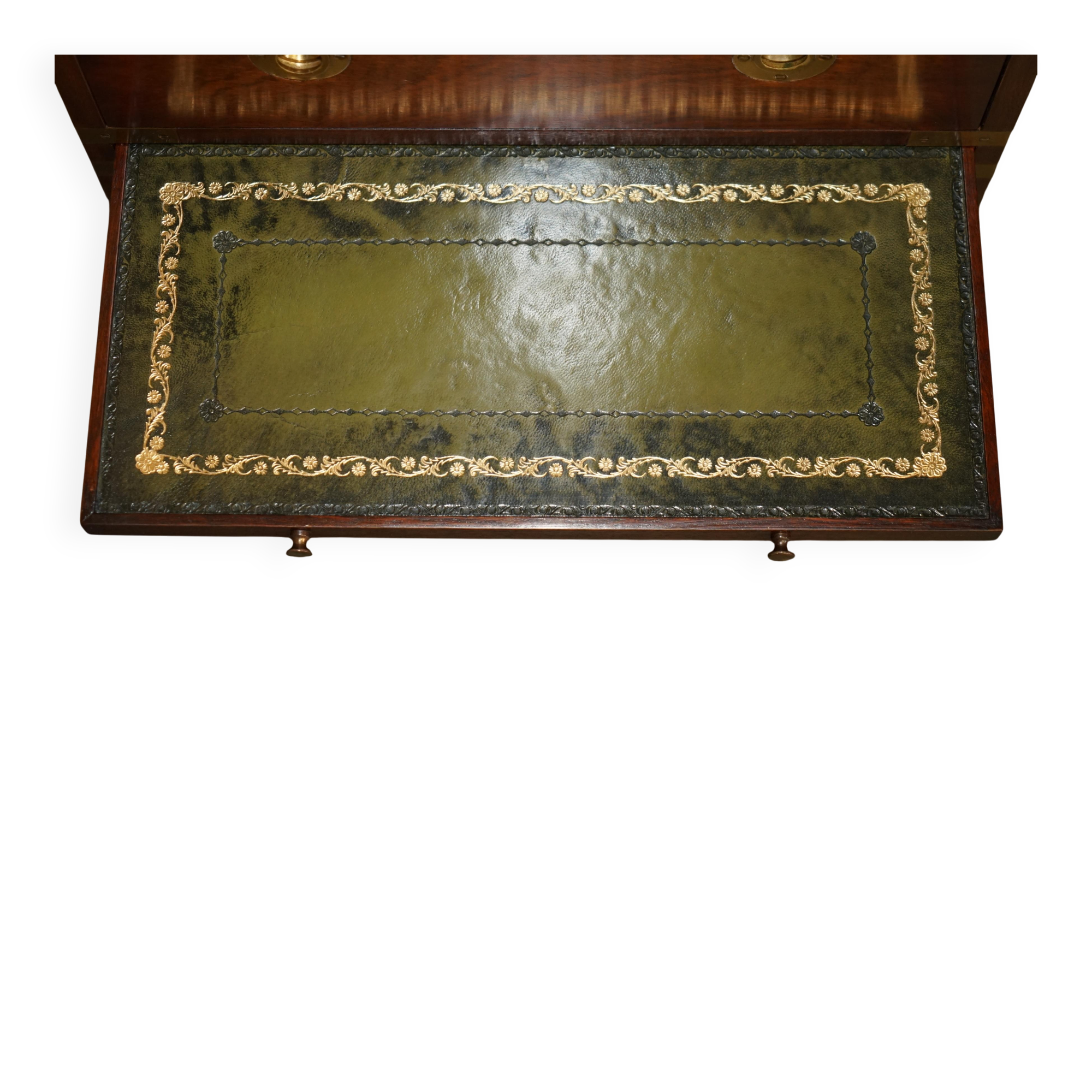 Pair of vintage military campaign high chests of drawers with leather tops.