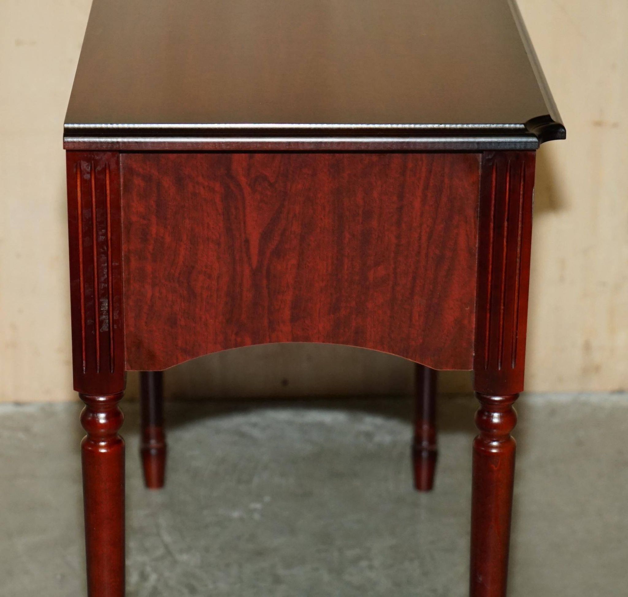 Small console with two drawers in hardwood finish.