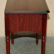 Small console with two drawers in hardwood finish.