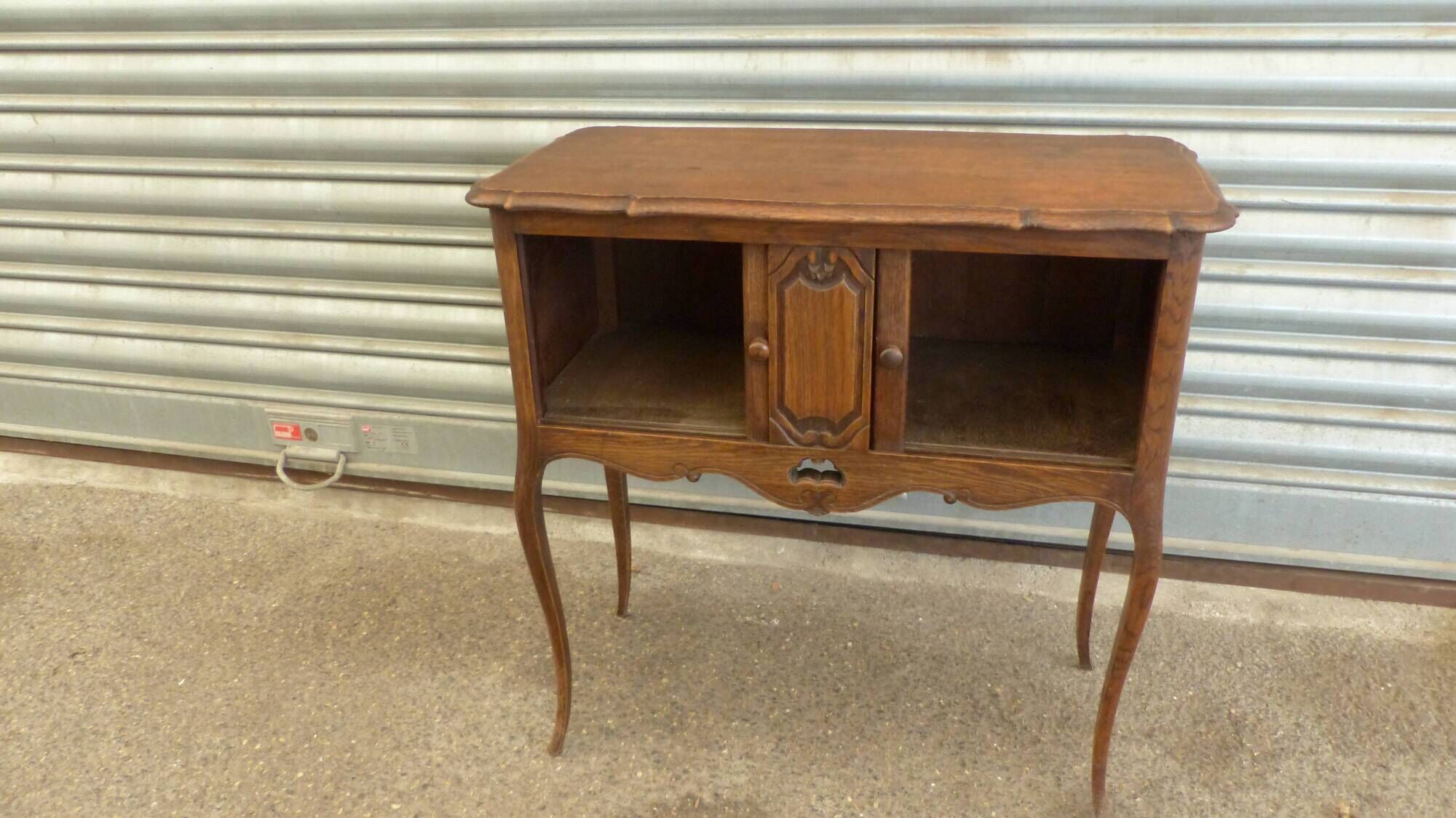Piece of furniture with two Louis XV-style curtains.