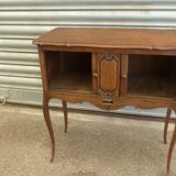 Piece of furniture with two Louis XV-style curtains.