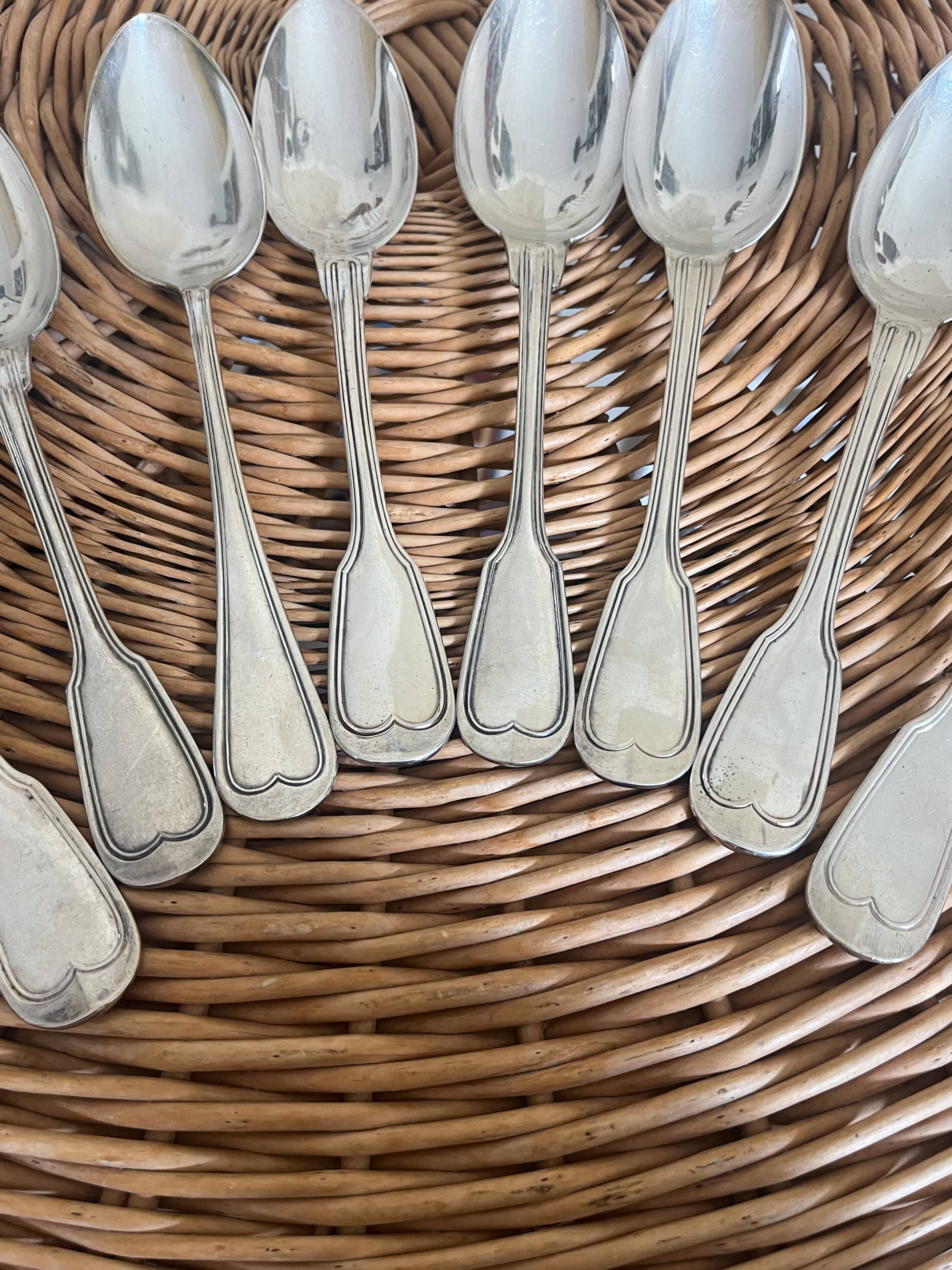 Set of 8 silver metal spoons