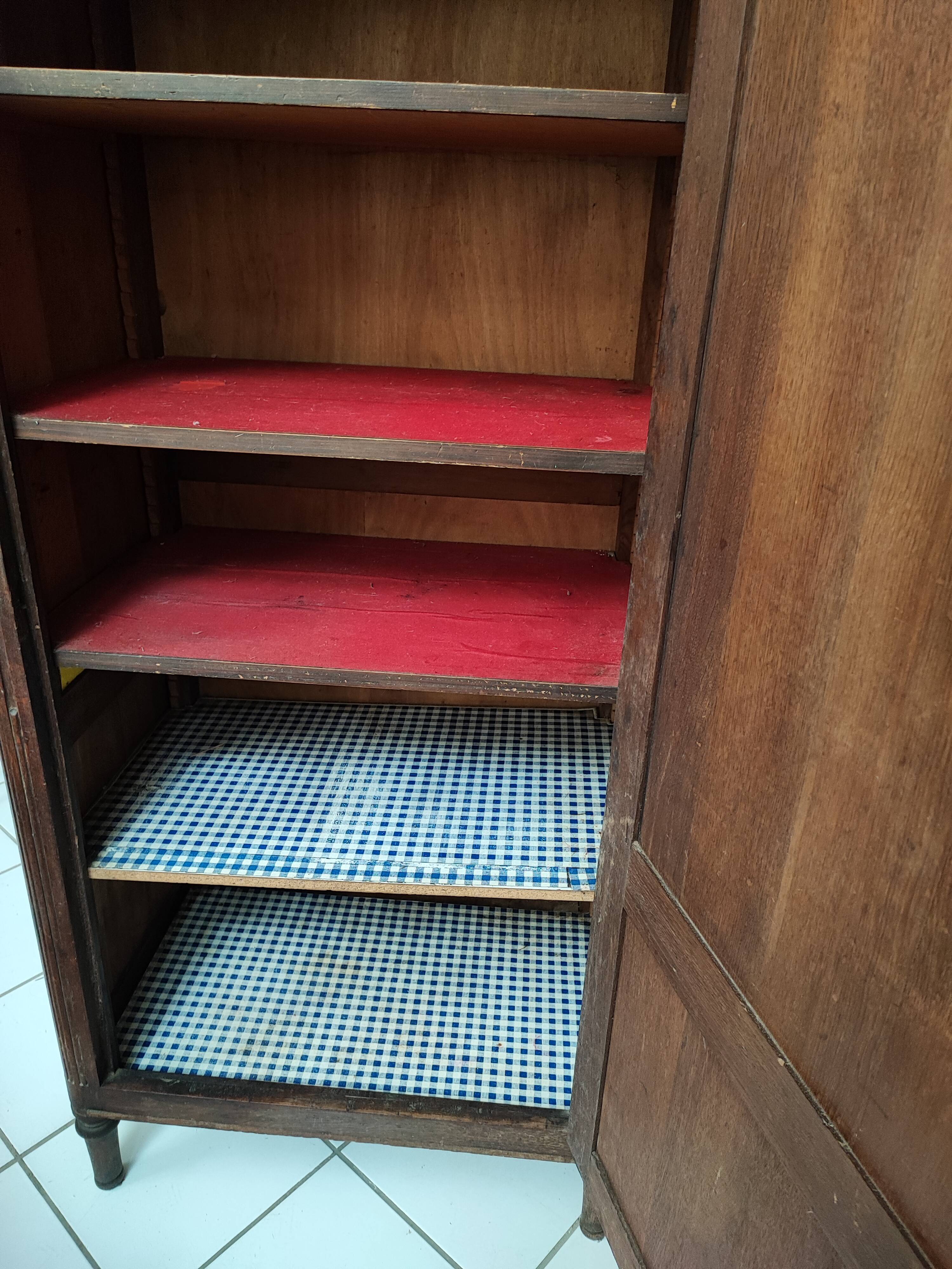 Bonnetière man standing cabinet a door