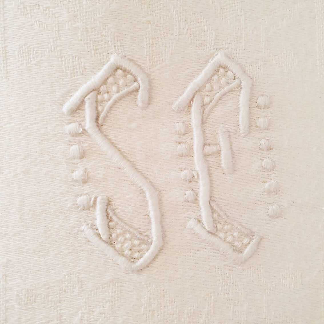 Old rectangular white tablecloth damask and monogrammed
