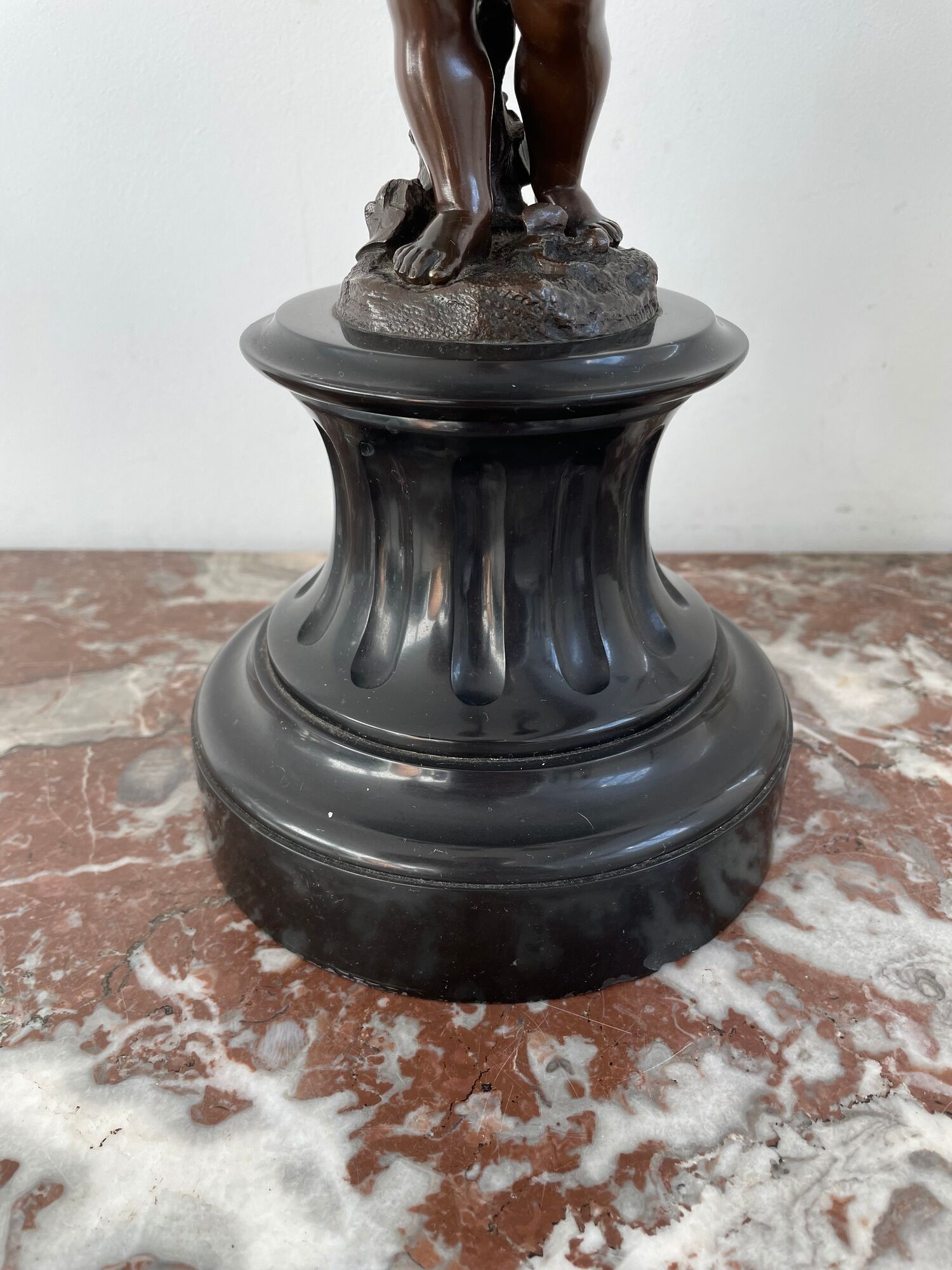 Candelabra with cherub in patinated bronze