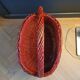 Red painted rattan basket