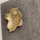 Golden brass bowl in the shape of a vintage leaf from the 1960s, organic design.