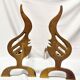 Pair of vintage design andirons bronze flame for fireplace