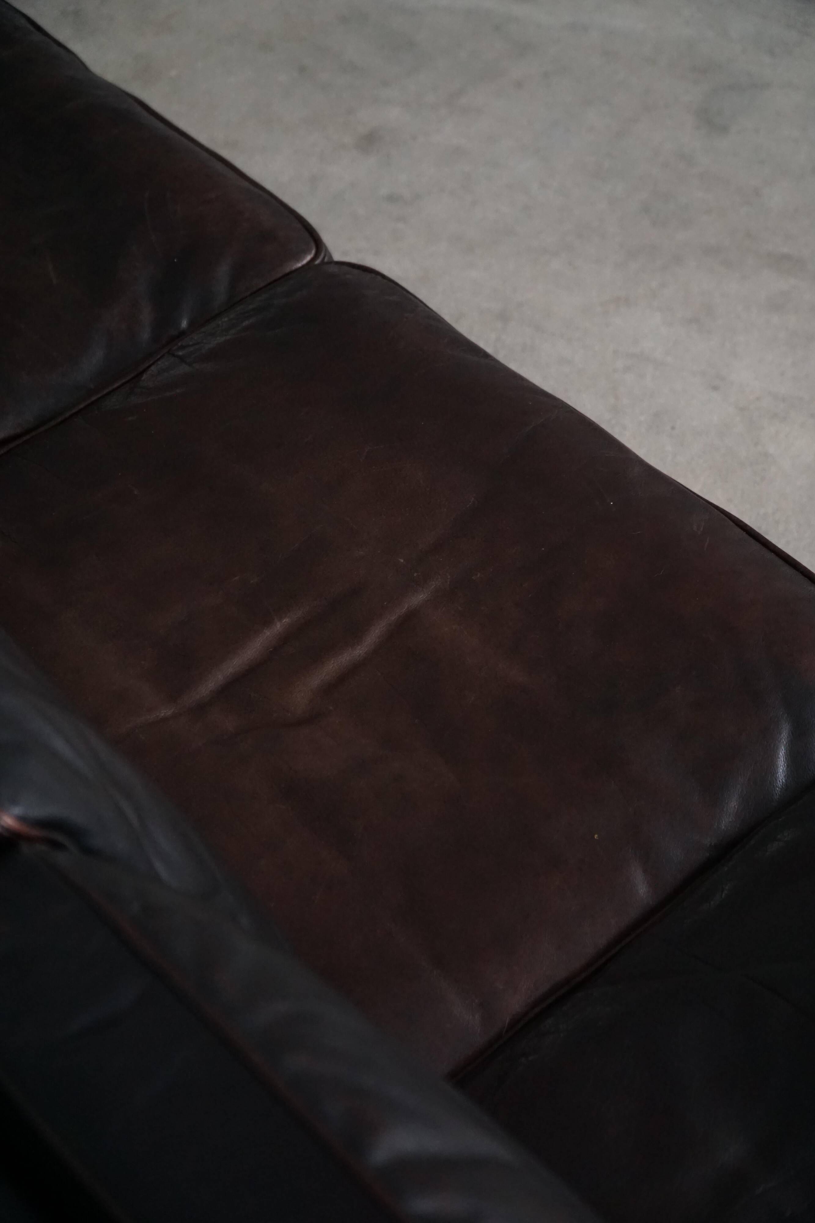 Three-seater canapé by Mogens Hansen, mid-century, in patinated black leather and solid beech.