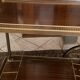 Servant table in gilded metal and mahogany mid-twentieth century