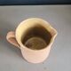 Antique milk jug in glazed terracotta