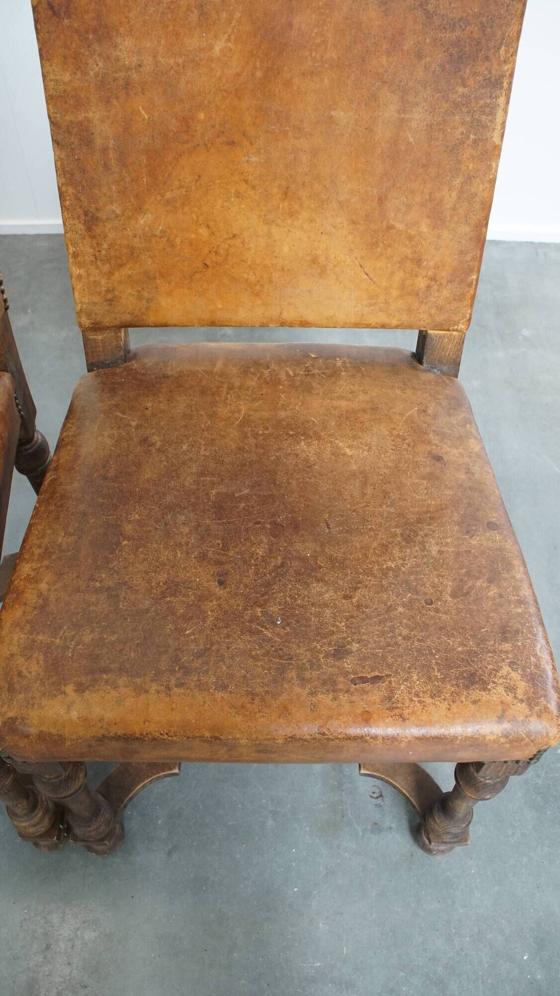 Set of 4 antique wooden and sheepskin leather dining chairs