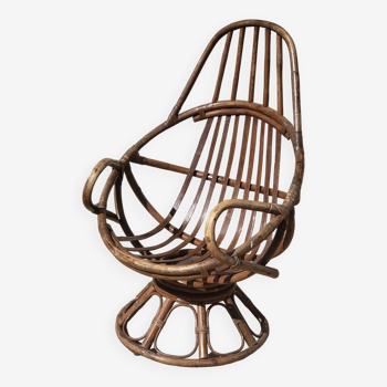 Vintage swivel rattan armchair