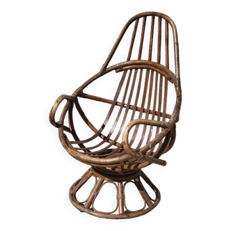 Vintage swivel rattan armchair