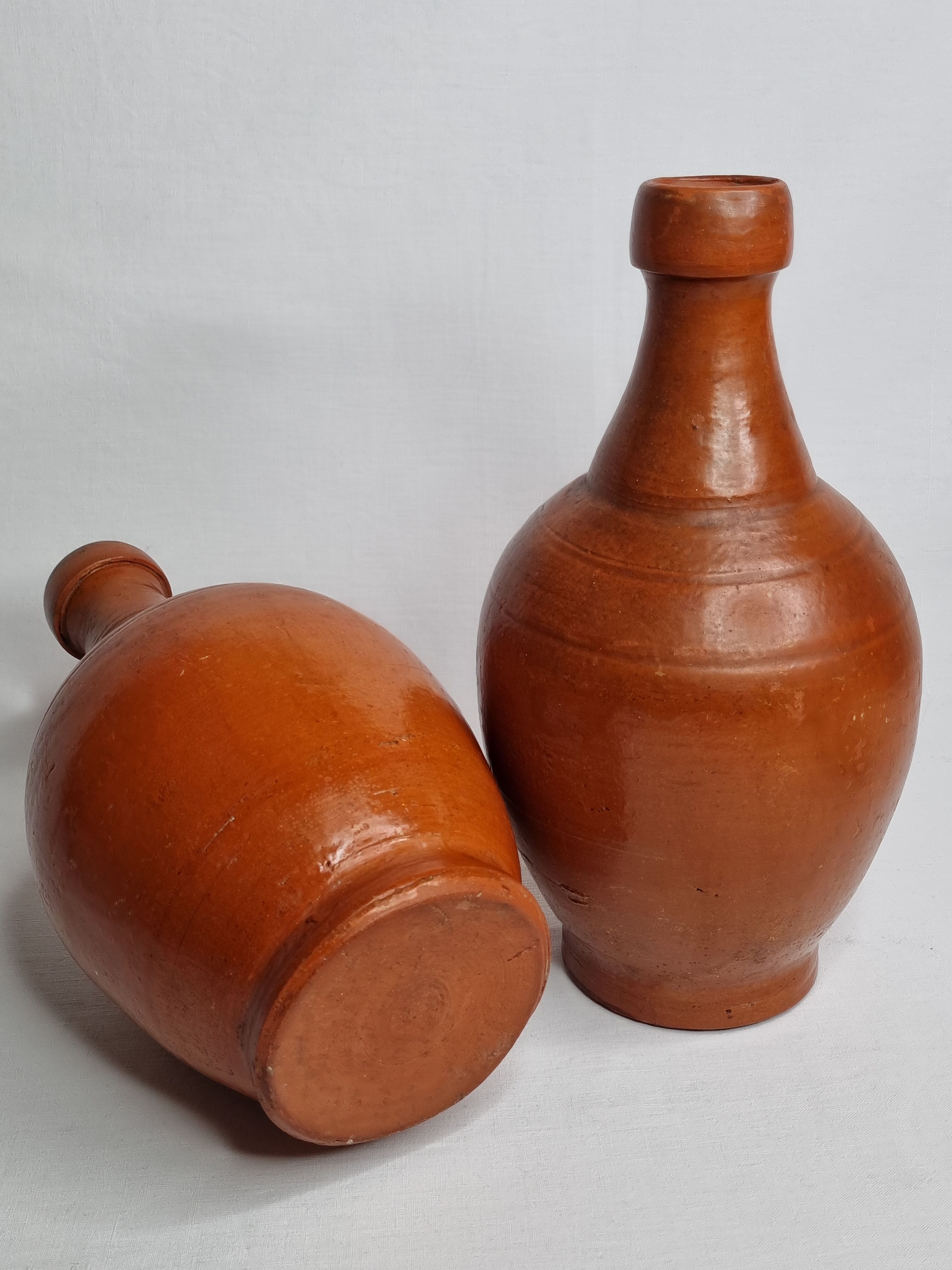 Pair of glazed terracotta jars, 26 cm