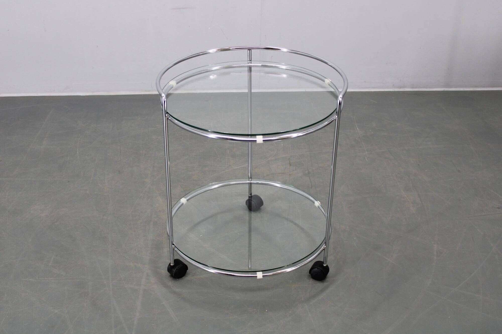 Mid-century round serving table, chrome and glass, Italy, 1980s