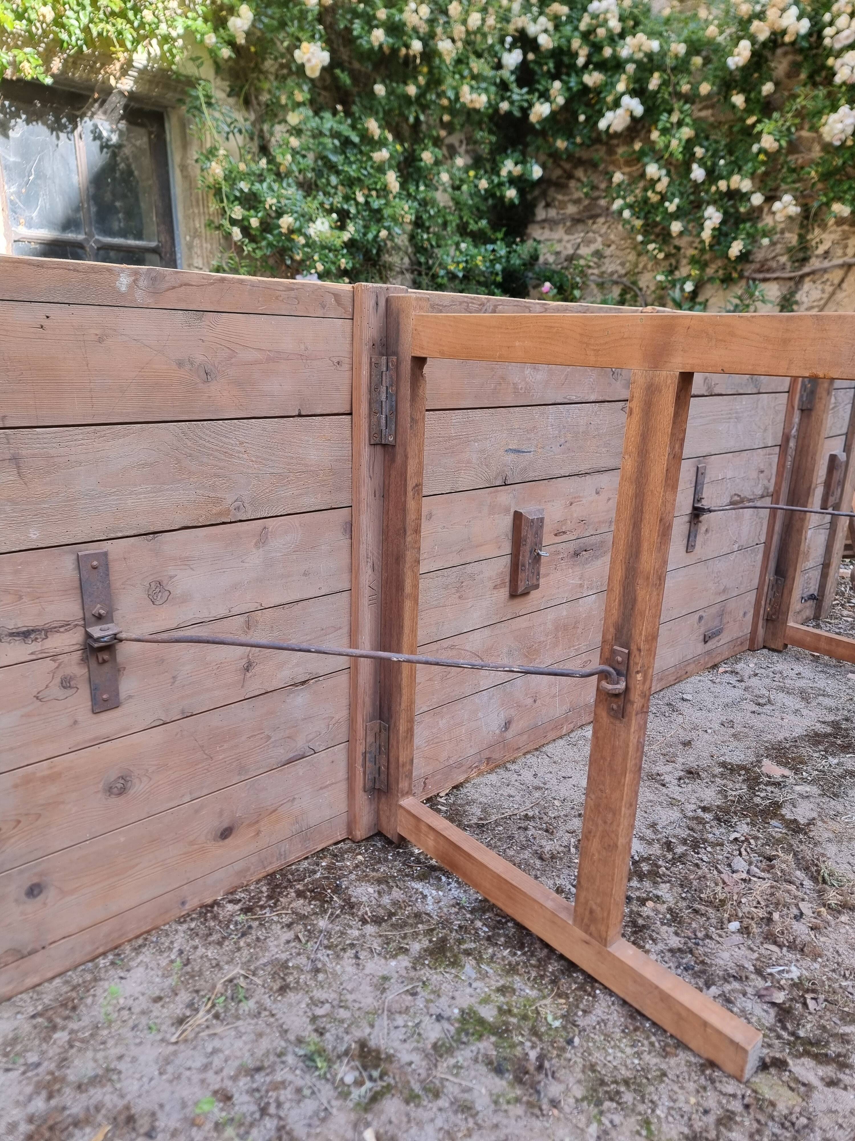 Antique French folding garden table set with benches, pine and chestnut, circa 1900–1920.