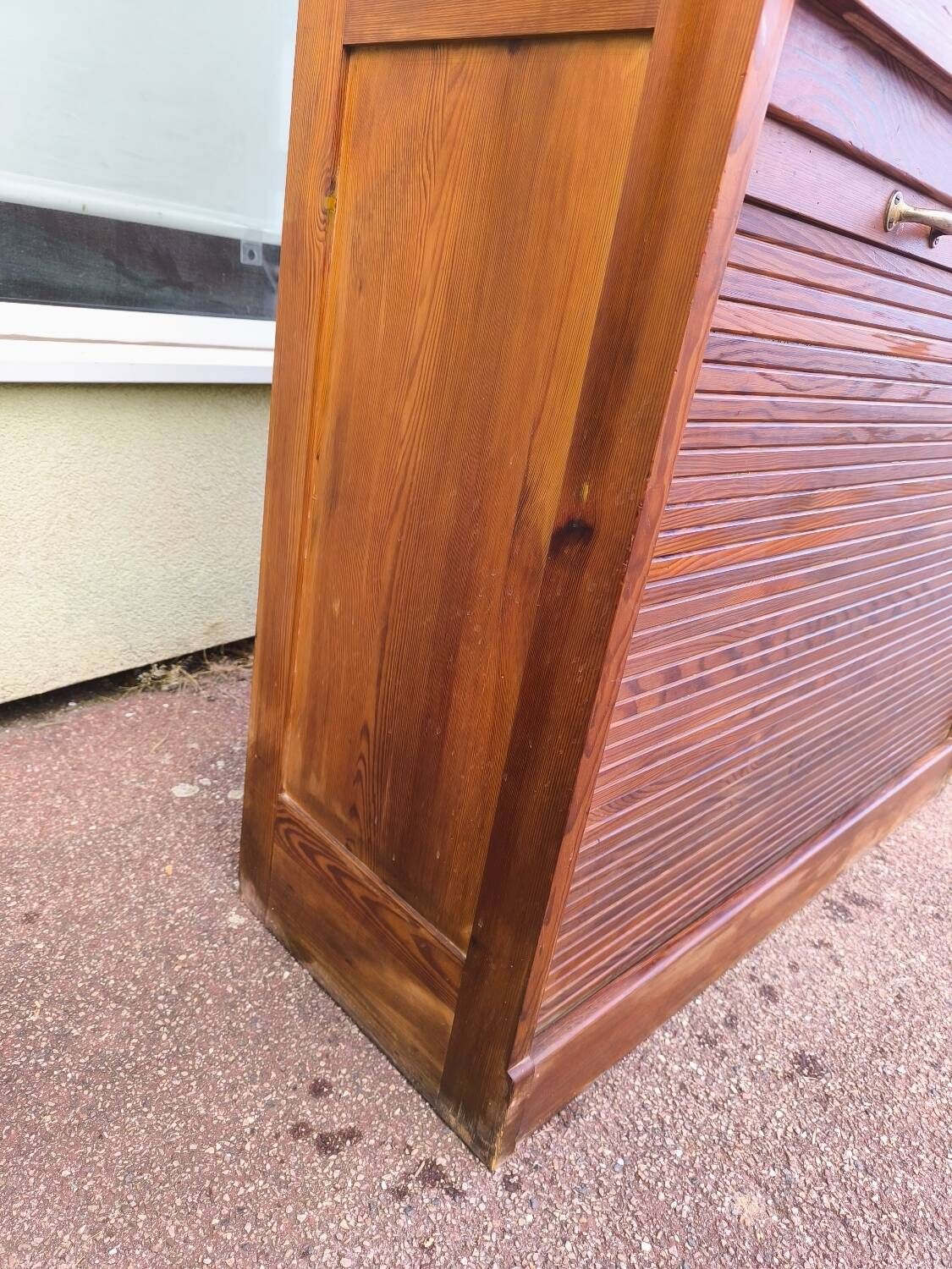Vintage 1940s secretary desk with wooden curtains, storage, and shutters.