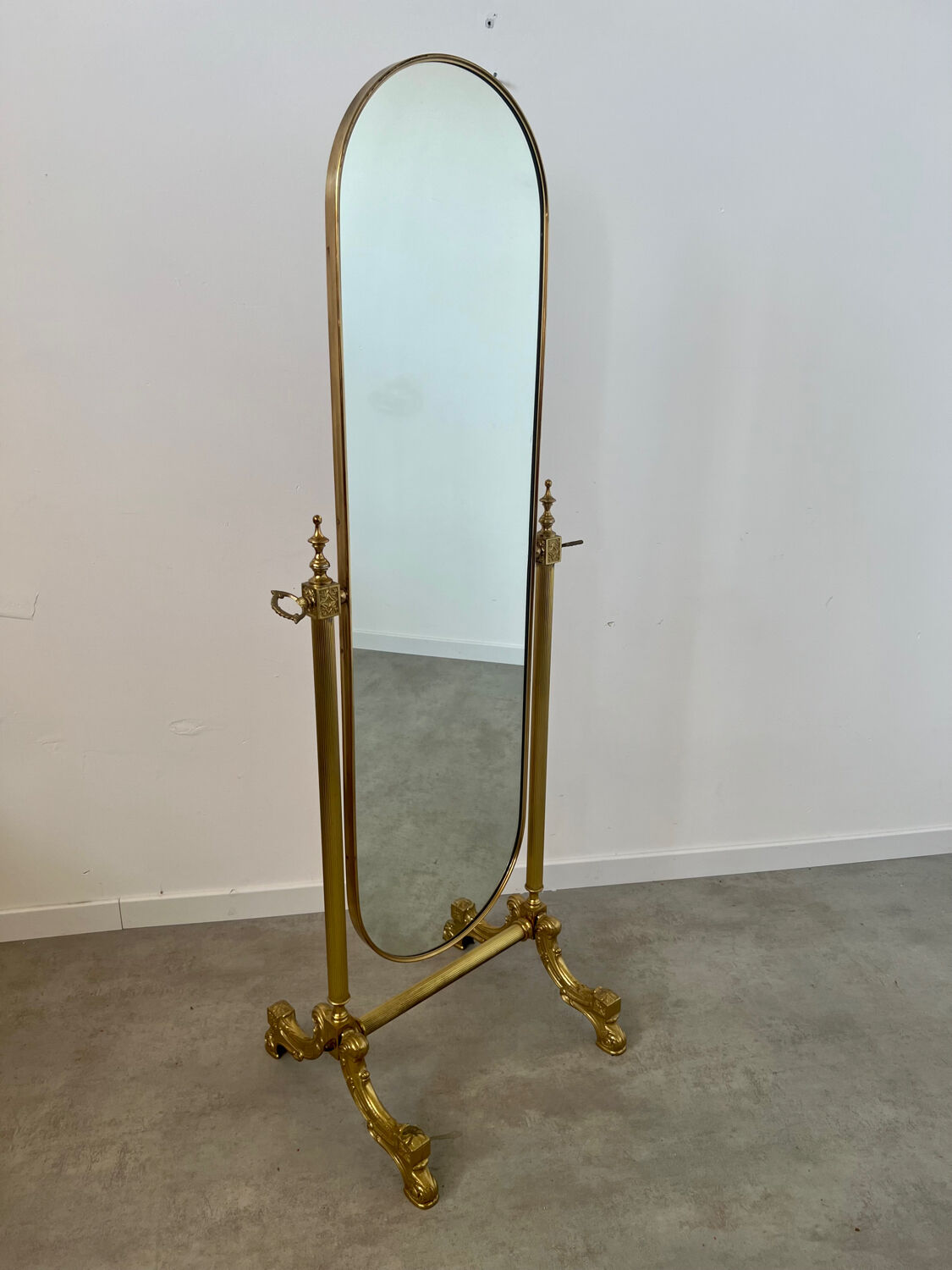 Old free-standing mirror in gilded brass in psychedelic neoclassical style Years 40 France