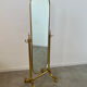 Old free-standing mirror in gilded brass in psychedelic neoclassical style Years 40 France